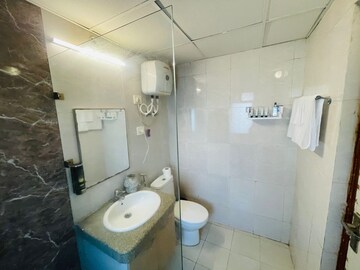 Bathroom in Studio Apartment at Nimbus The Golden Palm, Sector 168 – for Rent