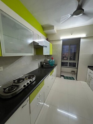 Kitchen in 3 BHK Apartment at Puranik Rumah Bali, Ghodbunder Road – for Sale
