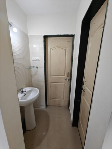 Bathroom in 1 BHK Apartment at Nisarg Hardik Phase II, Rahatani – for Sale