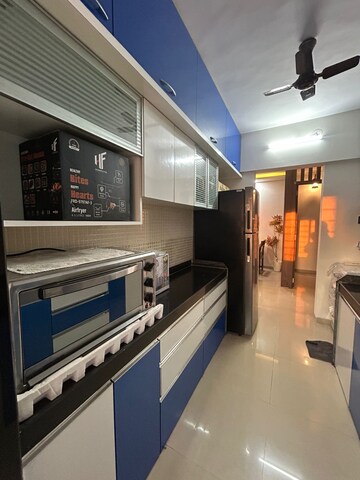 Kitchen in 2 BHK Apartment at Sudarshan Sky Garden, Ghodbunder Road – for Sale