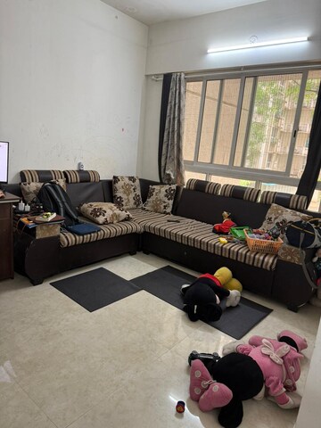 Living Room in 1 BHK Apartment at Lodha Amara, Kolshet Road – for Rent