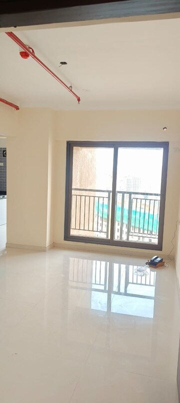 Room in 2 BHK Apartment at Raunak City Sector 4, Kalyan West – for Rent