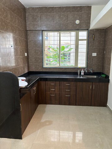 Kitchen in 1 BHK Apartment at Kamdhenu Jasmine CHS, Pimple Saudagar – for Sale