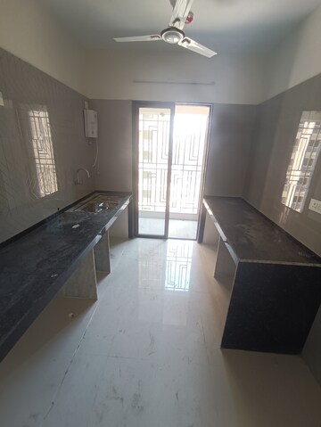 Kitchen in 3 BHK Apartment at Regency Antilia Phase V Avana, Ulhasnagar – for Sale
