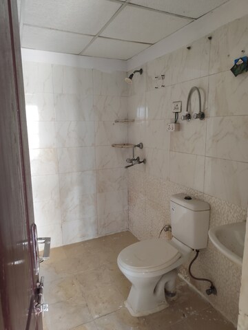 Bathroom in 2 BHK Apartment at Aims Golf City, Sector 75 – for Rent