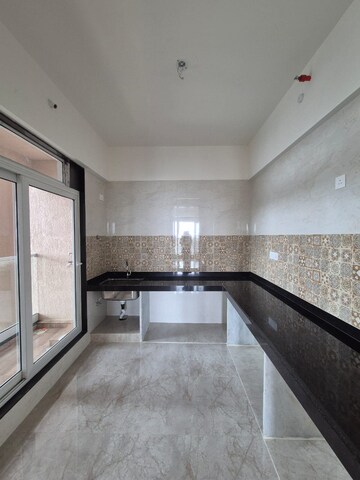 Kitchen in 2 BHK Apartment at Kamdhenu Vogue, Sanpada – for Rent