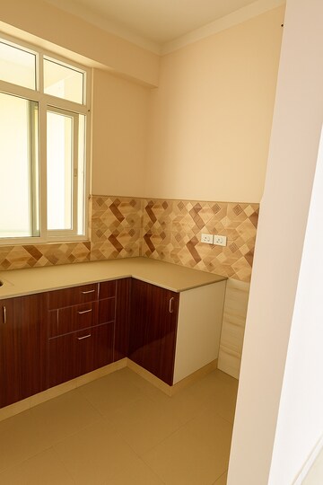 Kitchen in 2 BHK Apartment at Amrapali Kingswood, Sector 4 Greater Noida – for Sale