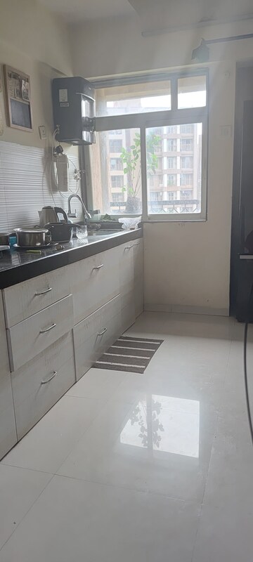Kitchen in 2 BHK Apartment at Squarefeet Ace Square, Ghodbunder Road – for Rent