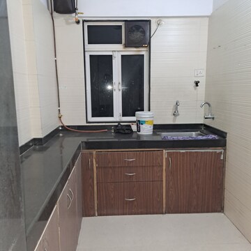 Kitchen in 1 BHK Apartment at Cosmos Classique, Ghodbunder Road – for Sale
