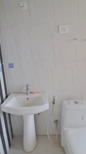 Bathroom in 2 BHK Apartment at Nilaya Greens, Raj Nagar Extension – for Sale