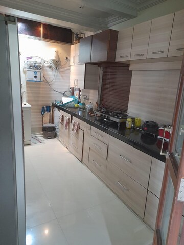 Kitchen in 2 BHK Apartment at Oshiwara Mhada, Andheri West – for Rent