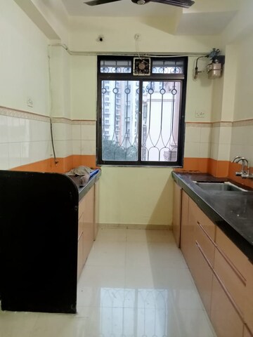 Kitchen in 2 BHK Apartment at Lodha Paradise, Majiwada – for Rent
