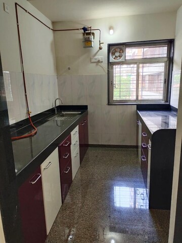 Kitchen in 1 BHK Apartment at Kalpataru Hills, Manpada – for Rent
