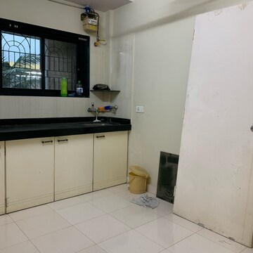 Kitchen in 1 BHK Apartment at Pranam CHS Borivalli West, Shimpoli – for Sale