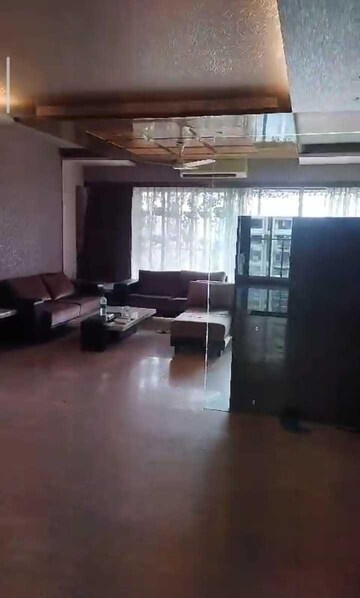 Living Room in 4 BHK Apartment at Infinite Poorna Apartments, Andheri West – for Rent