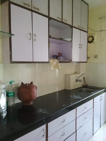 Kitchen in 1 BHK Apartment at Satellite Garden, Goregaon East – for Rent