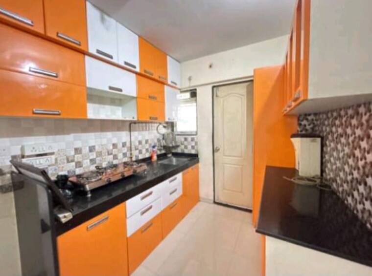 Kitchen, cosmos-orchid 1 Bedroom 650 Sq.Ft. Apartment In Ghodbunder Road Thane 9148216