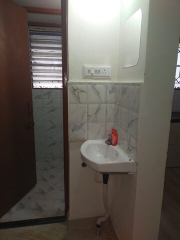 Bathroom in 1 BHK Apartment at Naiknavare Gardenia Society Phase 1, Wadgaon Sheri – for Rent
