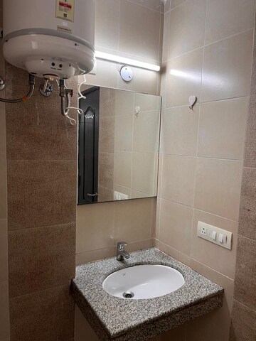 Bathroom in 2 BHK Apartment at Unitech Uniworld Gardens 2, Sector 47 – for Rent
