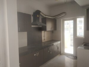 Kitchen in 3 BHK Apartment at Paramount Floraville, Sector 137 – for Sale