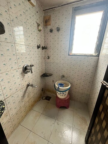 Bathroom in 1 BHK Apartment at Dhiraj CHS, Malad East – for Rent