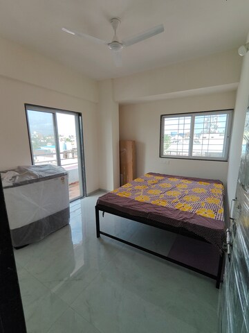 Bedroom in 1 BHK Apartment at Wadgaon Sheri – for Rent