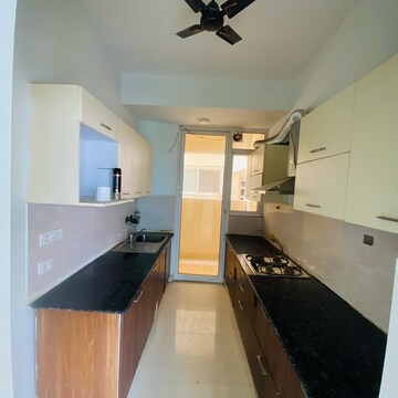 Kitchen in 3 BHK Apartment at Mahagun Mirabella, Sector 79 – for Rent
