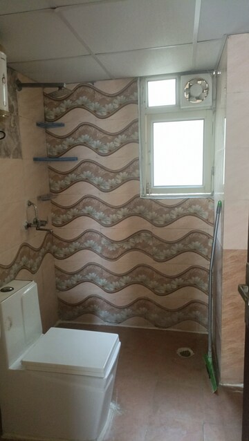 Bathroom in 2 BHK Apartment at Aims Golf City, Sector 75 – for Rent