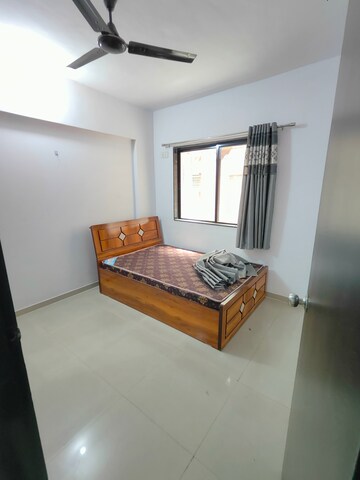 Bedroom in 2 BHK Apartment at Satyam Serenity, Wadgaon Sheri – for Rent