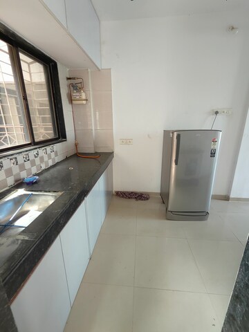 Kitchen in 2 BHK Apartment at Satyam Serenity, Wadgaon Sheri – for Rent