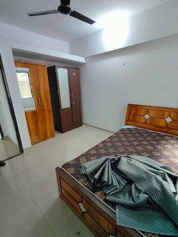 Bedroom in 2 BHK Apartment at Satyam Serenity, Wadgaon Sheri – for Rent