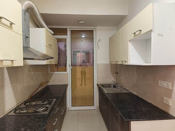 Kitchen in 3 BHK Apartment at Amrapali Crystal Homes, Sector 76 – for Sale