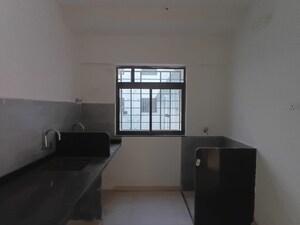 Kitchen in 2 BHK Apartment at Roshan Milestone, Tathawade – for Rent