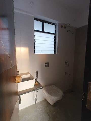 Bathroom in 4 BHK Apartment at Roshan Milestone, Tathawade – for Rent