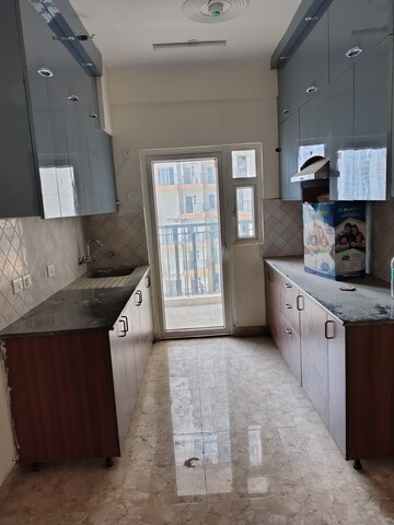 Kitchen in 3 BHK Apartment at Amrapali Terrace Homes, Tech Zone 4 Greater Noida – for Rent