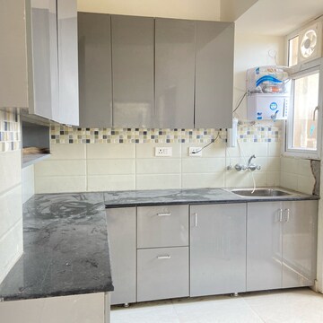 Kitchen in 2 BHK Apartment at Signature Global Orchard Avenue, Sector 93 – for Rent