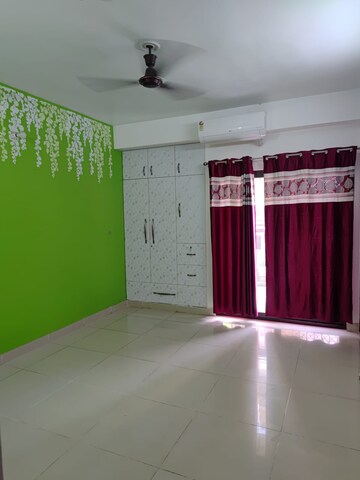 Room in 2 BHK Apartment at Charms Castle, Raj Nagar Extension – for Rent