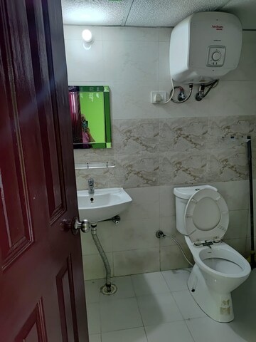 Bathroom in 2 BHK Apartment at Charms Castle, Raj Nagar Extension – for Rent