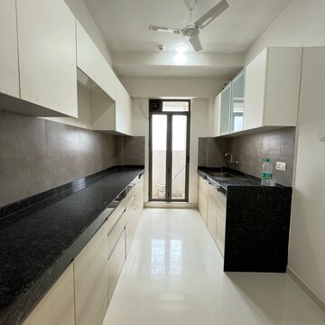 Kitchen in 4 BHK Apartment at Rustomjee Summit, Datta Pada – for Rent