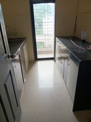 Kitchen in 2 BHK Apartment at Lalani Residency, Kavesar – for Sale