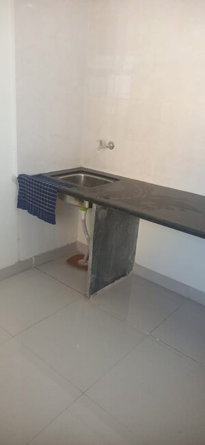 Kitchen in 2 BHK Apartment at KM Horizon Flora, Ghodbunder Road – for Sale