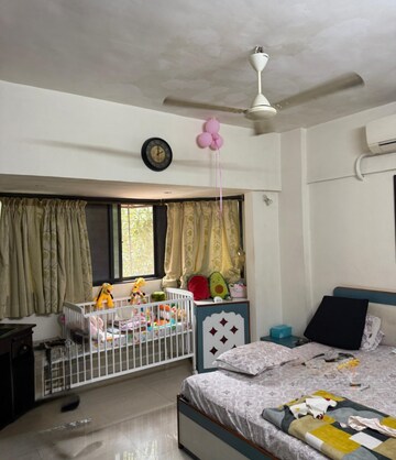 Bedroom in 2 BHK Apartment at Lokhandwala Breeze Apartments, Andheri West – for Rent