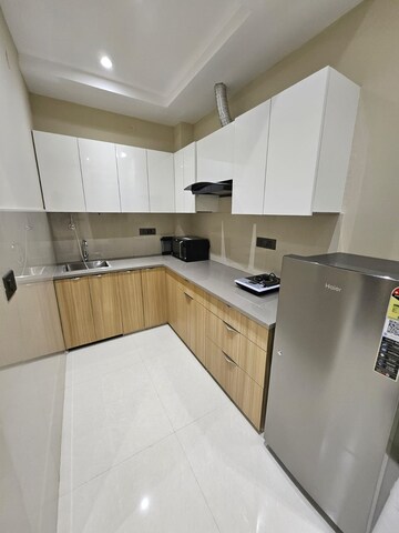 Kitchen in 3 BHK Builder Floor at Ansal Sushant Residency, Sushant Lok Iii – for Sale