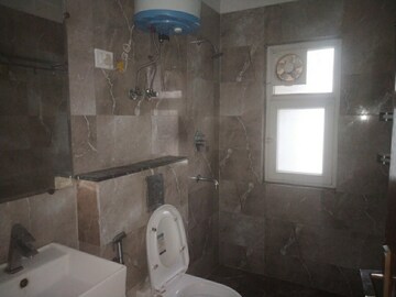 Bathroom in 4 BHK Apartment at Sunworld Arista, Sector 168 – for Sale