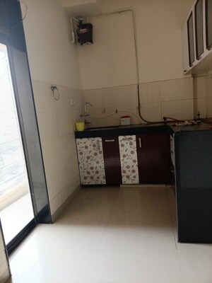 Kitchen in 2 BHK Apartment at Lalani Residency, Kavesar – for Sale