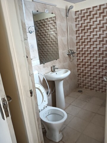 Bathroom in 2 BHK Apartment at Gaur Yamuna City, Gaur Yamuna City – for Rent