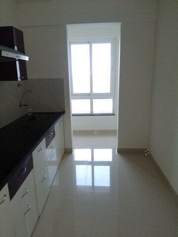 Kitchen in 2 BHK Apartment at Puranik Rumah Bali, Ghodbunder Road – for Rent