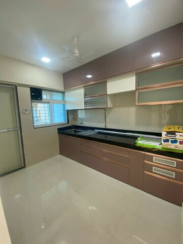 Kitchen in 2 BHK Apartment at Cosmos Habitat, Majiwada – for Rent