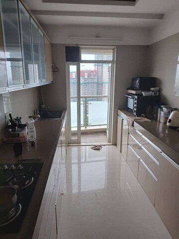 Kitchen in 4 BHK Apartment at Dosti Group Imperia, Manpada – for Rent