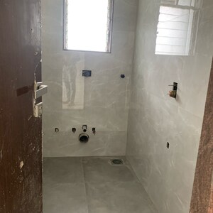 Bathroom in 2 BHK Apartment at Kosmos Kedar Darshan, Kastur Park – for Sale